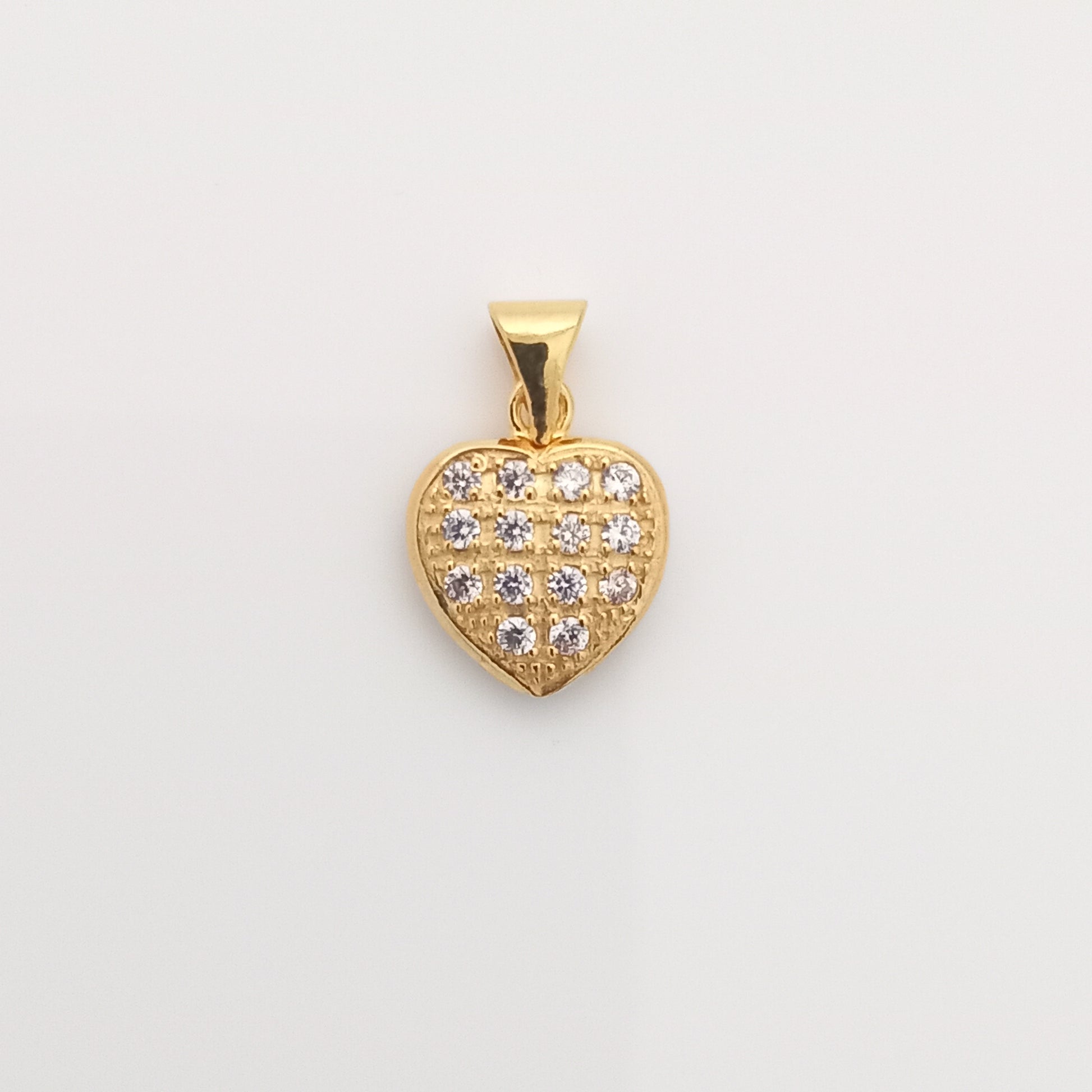 Closeup of Heart-Shaped Gold Pendant with CZ Stones