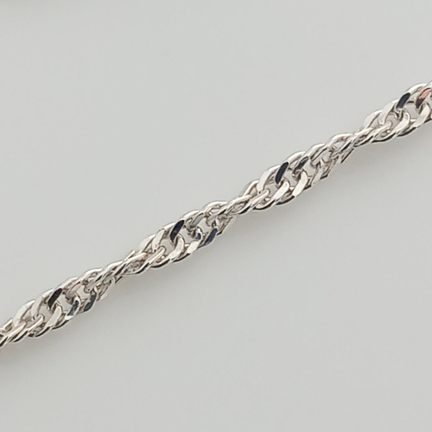 Closeup of Singapore Style Silver Chain Bracelet