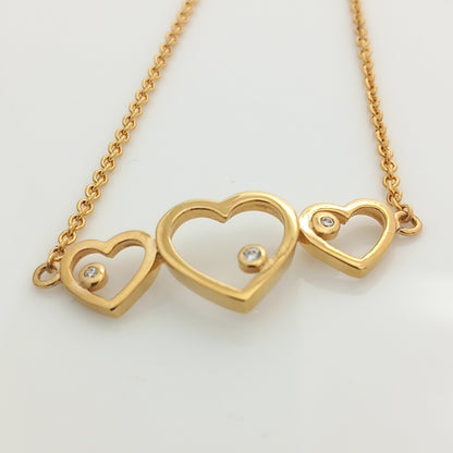 Closeup of Triple Heart Gold Chain Bracelet