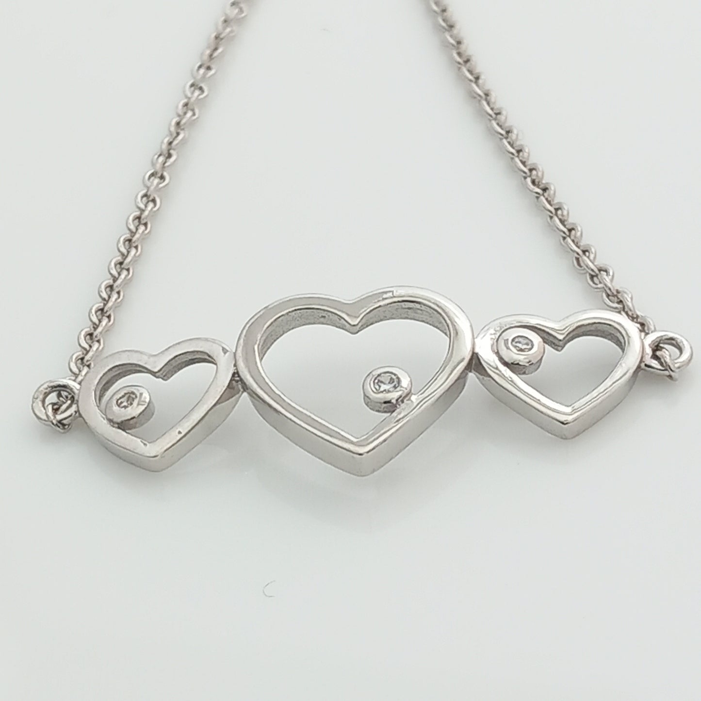 Closeup of Triple Heart Silver Chain Bracelet