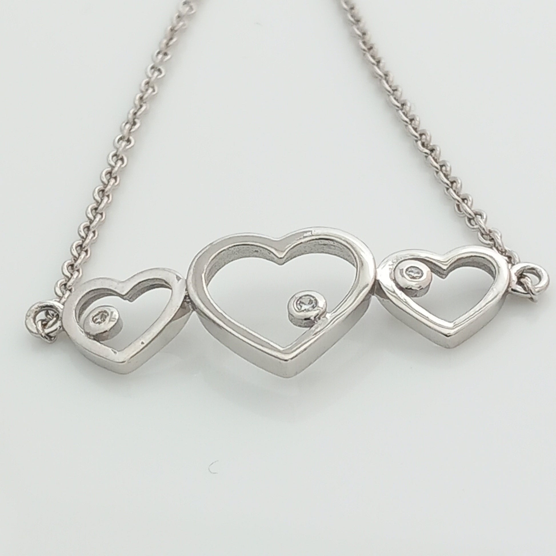 Closeup of Triple Heart Silver Chain Bracelet
