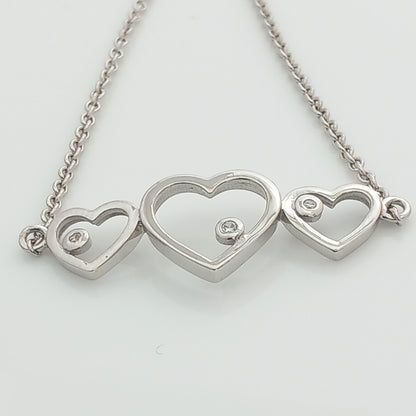 Closeup of Triple Heart Silver Chain Bracelet